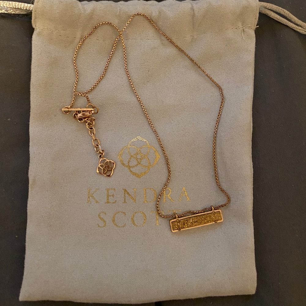 Kendra Scott gold extended length pendant necklace.